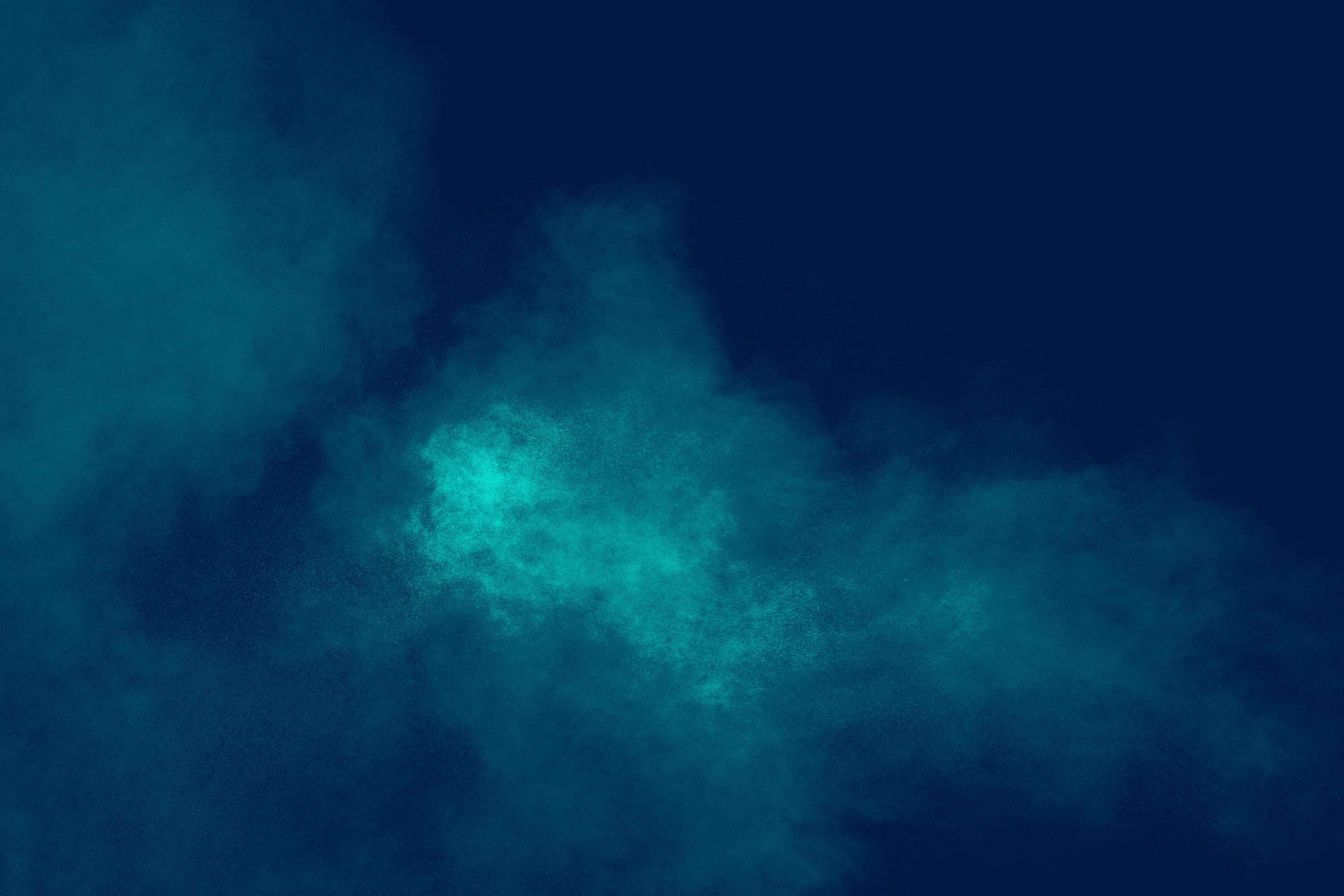 Abstract explosion of orange dust on black background.Freeze motion of orange powder burst.